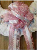 I made this diaper wreath for our granddaughter, Ainsley nursery. I wanted to customize it, so 